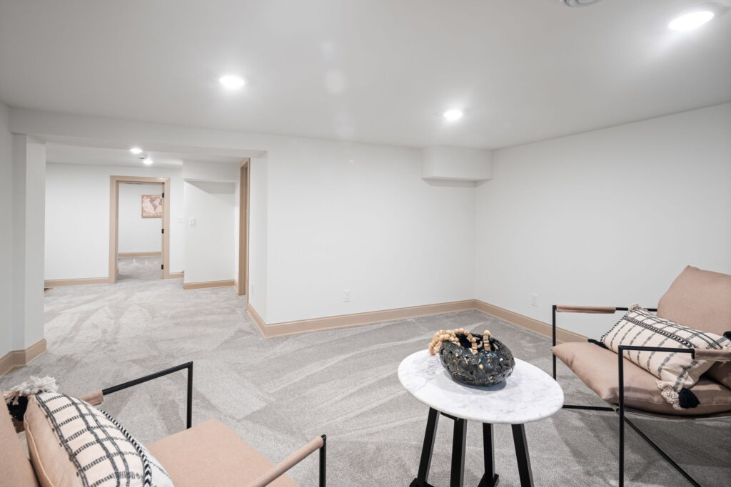Finished basement with carpet. Open concept basement living area 