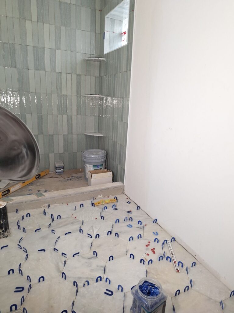 Bedrosians tile shower progress. Walk-in shower bathroom remodel